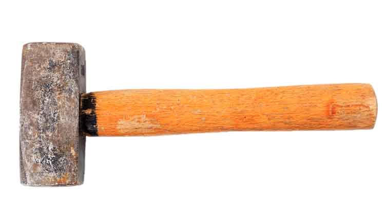 Old hammer isolated on white background, top view